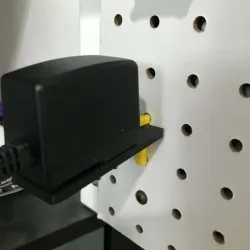 Parametric US power plug or adapter/charger holder for pegboards
