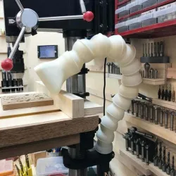 Suction arm for a drill press