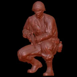 VIETNAN SOLDIER CROUCHING WITH M16