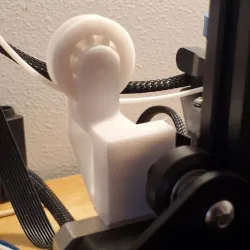 Ender 3 V2 Filament Guide with wheel and print in place bearing