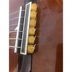 Classical guitar string ties bed