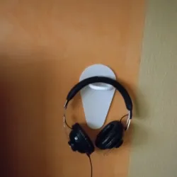 Headset headphone holder
