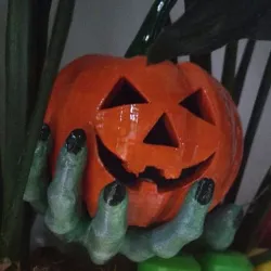 A pumpkin in a Zombie hand