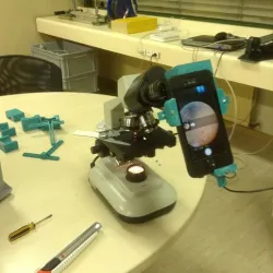 Smartphone adapter for microscope