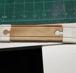 Wood train track ramp with hole