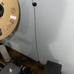 Filament guide for floor, wall, or ceiling mounted spool