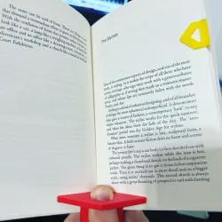 Reading aid thumb page separator