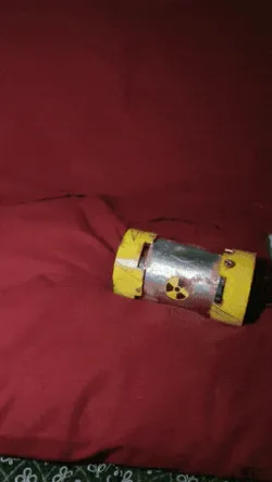 Baby alien + radioactive container