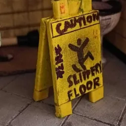 "Caution Slippery Floor" sign.