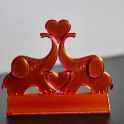 Playful Elephants Holding Heart with Trunks - A Charming 3D Printed Figurine Celebrating Love and Affection