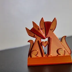 Whimsical 3D Printed Foxes Holding Heart