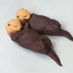 Sea Otters holding hands