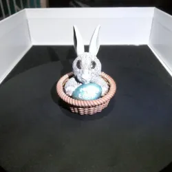 Easter Bunny in a basket with easter Egg.