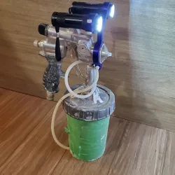 Flashlight holder for spray gun