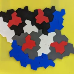Reversible aperiodic hat tiles