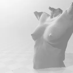 A 3D classical nude torso statue.