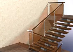 Stair and Stainless steel handrail with hardened tinted glass.