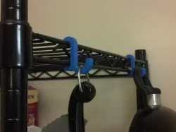 Snap in wire shelving hook.