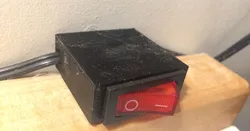 Rocker switch enclosure