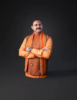 man wearing orange kurta and scarf with arms crossed