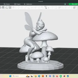 Dainty garden fairy napping on a group of mushrooms, figurine, statue