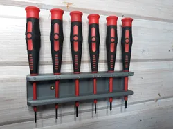 Wall mounted screwdriver holder