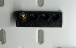 Nozzle holder for IKEA Skadis Pegboard