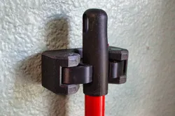 Broom Hanger w/ flexible jaws