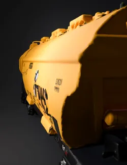 yellow TEUS freight hopper car with black undercarriage on railway tra