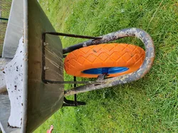 Spacer for garden wheelbarrow