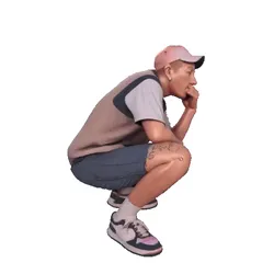 Boy with cap crouching