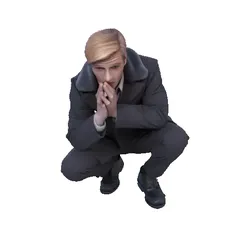 Man in suit crouching