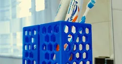 Toothbrush/toothpaste holder