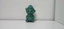 Free Home Decorations & Ornaments STL Download - Sitting Elf with Gift Box Christmas Figurineby 3DMaster1