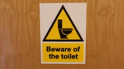 Beware of the toilet sign