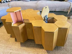 Modular honeycomb coffee table with built-in storage and pop-up light