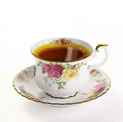 White Porcelain Teacup And A Plate With Tea And Floral Design 3D model