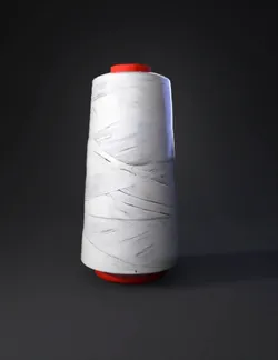 white thread spool with red plastic core and coiled thread texture
