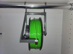 Hanger for Universal Auto-Rewind Spool Holder with Attachment System