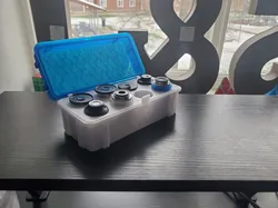 Storage box for microscope lenses