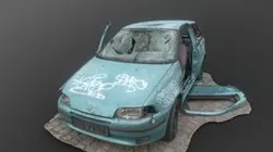 Derelict green car wreck