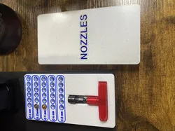 Nozzle box with tool slot