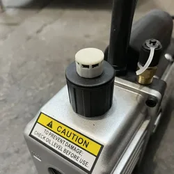 Vacuum pump cap exhaust