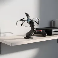 modern eyeglass holder doubles as a piece of art