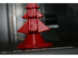 Christmas tree ornament with train going around it print in place no supports one piece