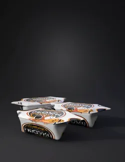 wrapped Polish toffee candy packages with white wrappers and black ora