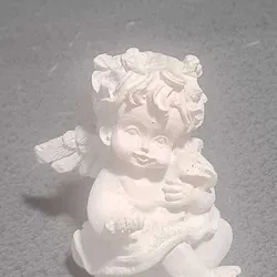 crouching angel with rose