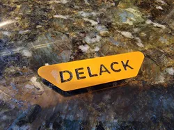 Deeper recess color change DELACK nameplate