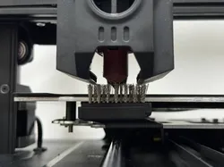 Ender 3 V3 KE and SE automatic nozzle cleaning brush.