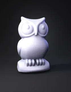 red owl figurine stylized sculpture with rounded eyes perched on a ba